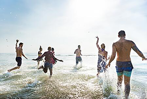 People running in the beach