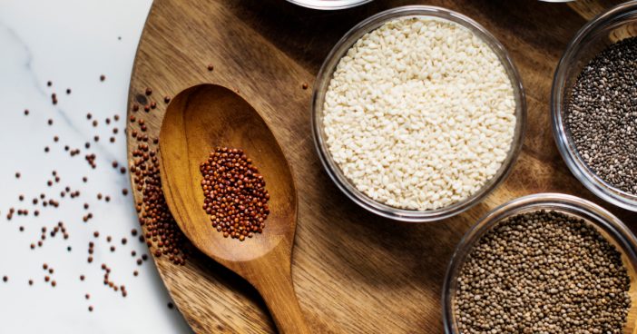 Aerial of seeds superfood on wooden board and spoon