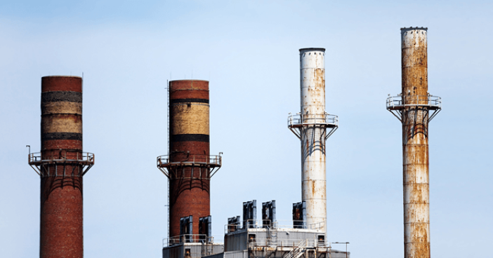 four-smoke-stacks-atop-factories-659x